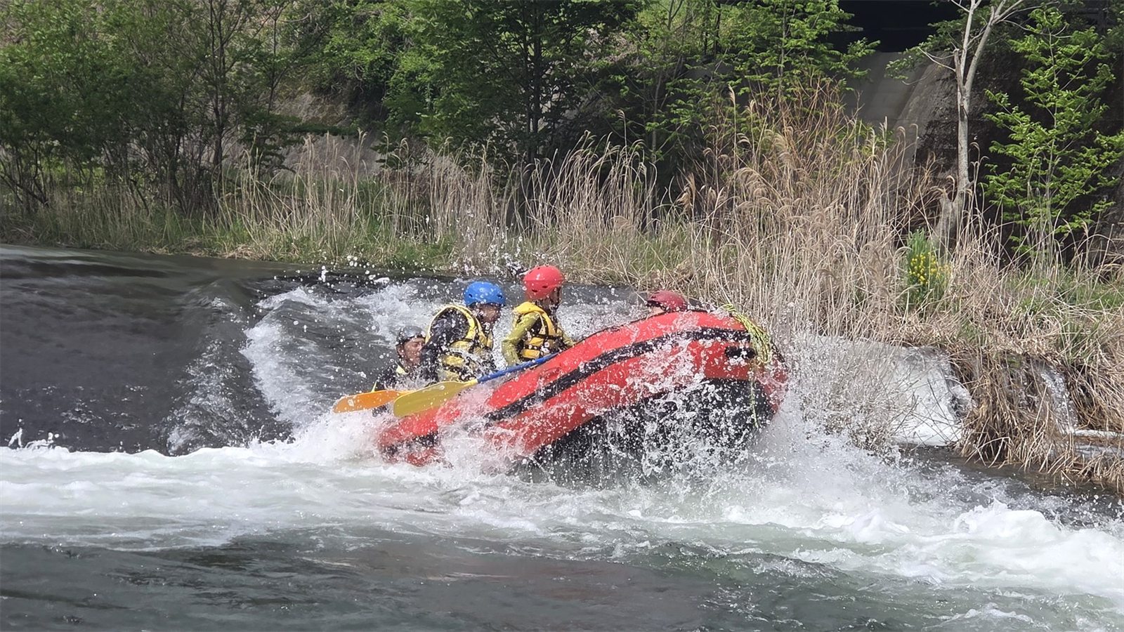 Guests rafting through white water on a Gunma mountain river