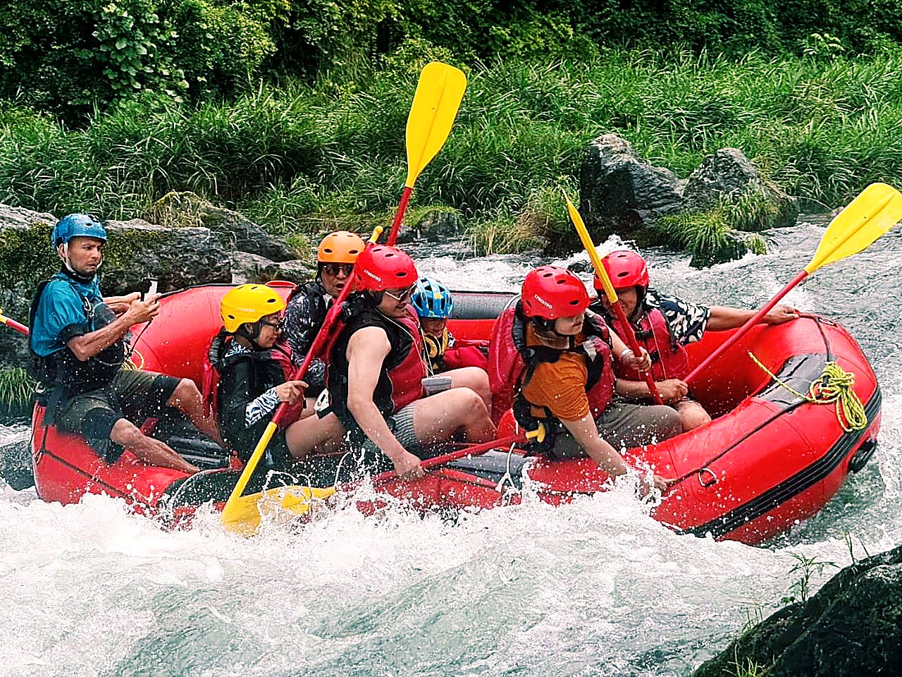 Rafting in Japan adventure with guests paddling through whitewater